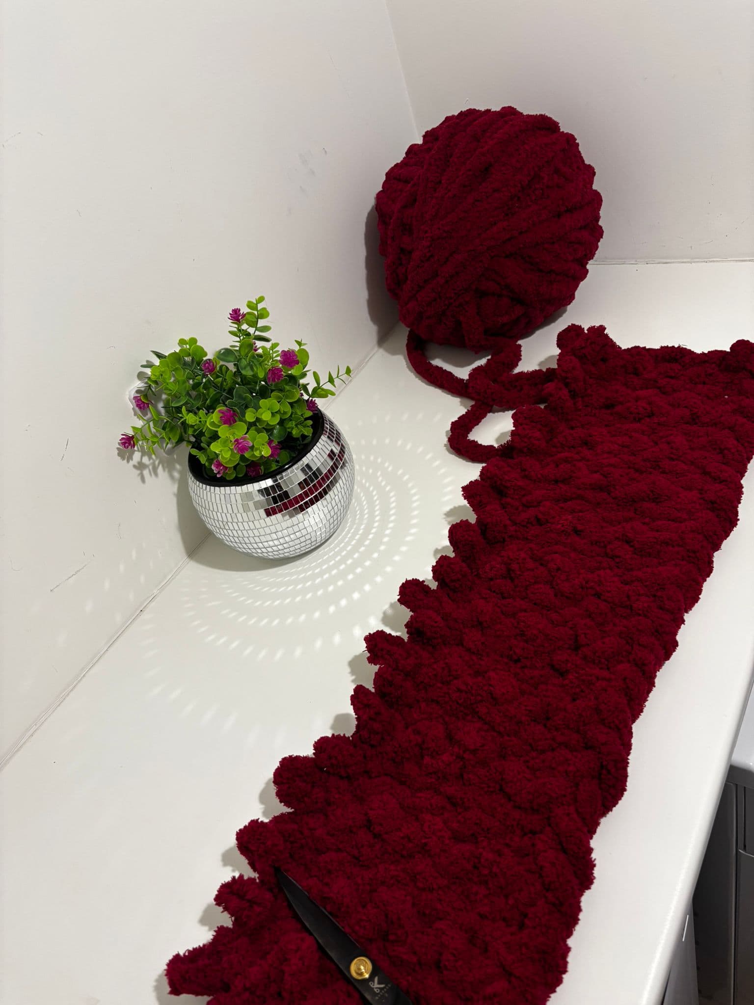Chunky burgundy yarn and handmade blanket — the beginning of Cozi Handmade